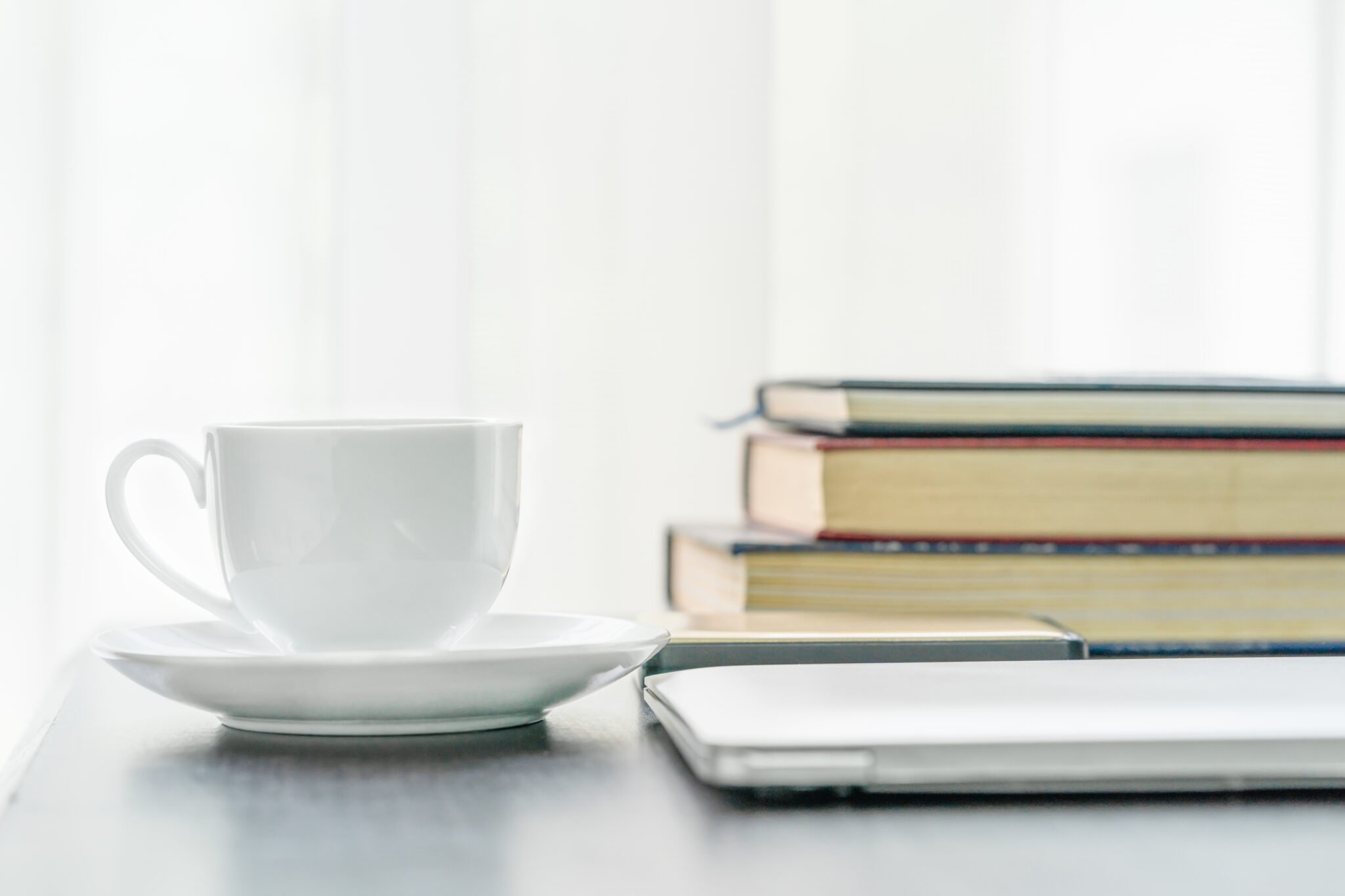 coffee cup and book on table